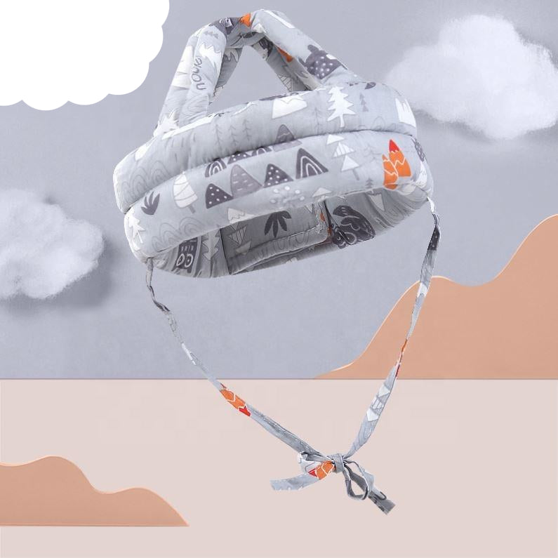 Baby carrier with gray forest design against a minimalistic background